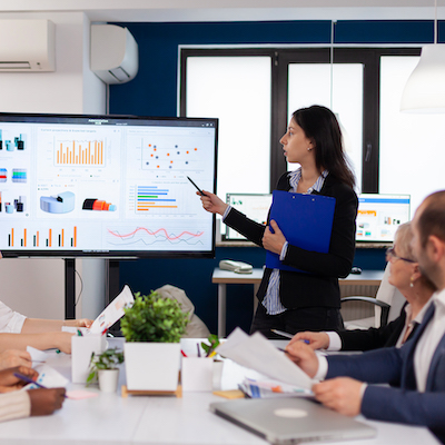 Young team leader in big corporation briefing coworkers